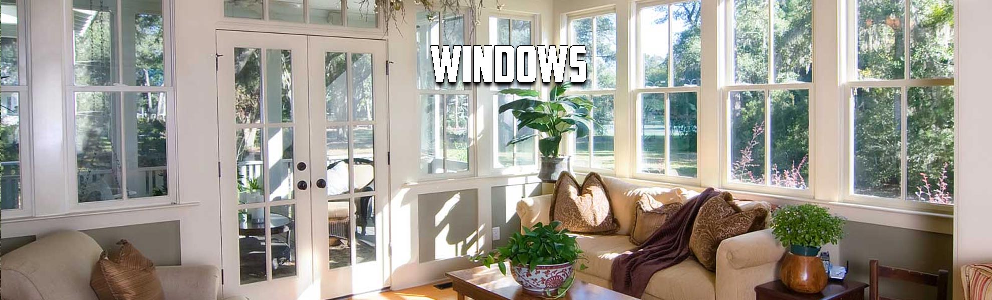 Living room area surrounded by windows