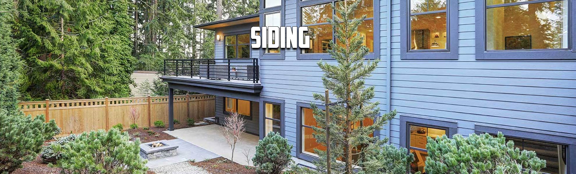 Large, higher-end home with light blue siding